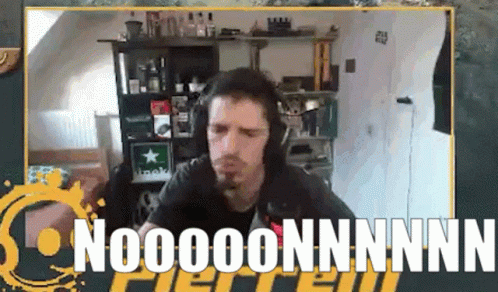 Man With Headphones Sitting In Front Of Nooooonnnnn Sign GIF