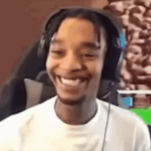 Man With Headphones Smiling At Camera GIF