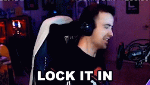Man With Headphones Smiling in Gaming Chair