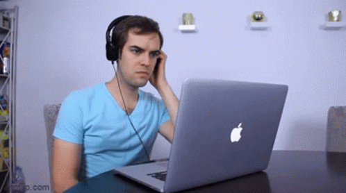 Man With Headphones Using Apple Laptop GIF