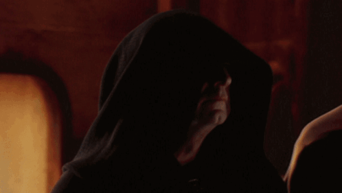 Man with Hood Looking at Something