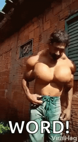 Man With Huge Muscles In Front Of Brick Building GIF