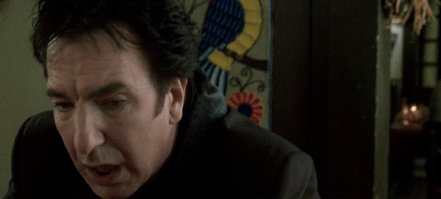 Man With I Beg Your Pardon Behind Him GIF