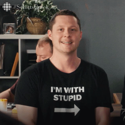 Man With I'm With Stupid Shirt GIF
