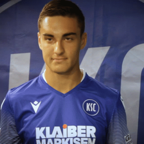 Man with KSC on Blue Shirt