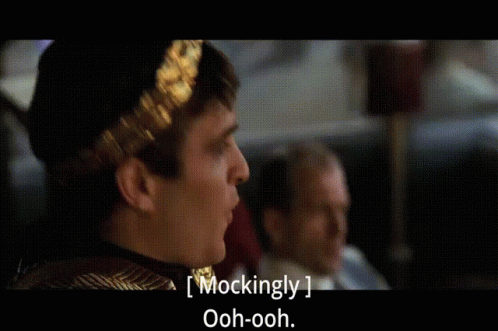 Man With Laurel Wreath Mockingly Saying Ooh Ooh GIF
