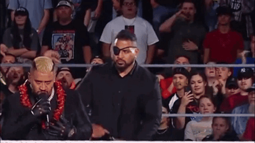 Man With Lei Holding I Love You Sign GIF