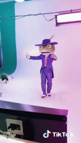 Man With Lizard Head Costume Dancing GIF