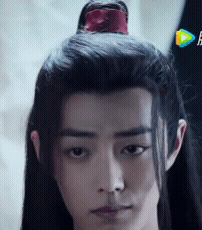 Man with Long Black Hair and Red Flower