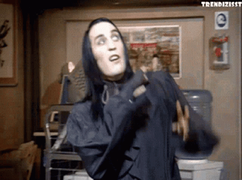 Man With Long Black Hair In Hooded Jacket GIF