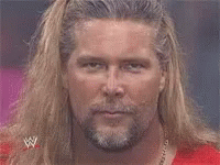Man with Long Blonde Hair and Beard in Red Shirt