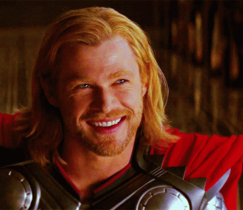 Man With Long Blonde Hair and Beard Smiling