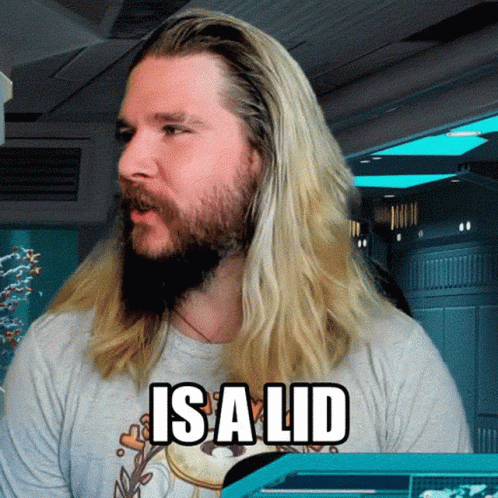 Man With Long Blonde Hair And Beard Wearing Isalid Shirt GIF
