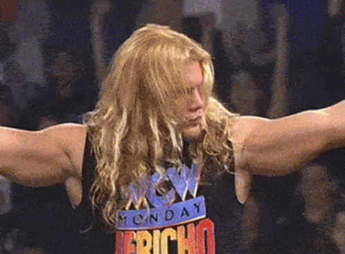 Man with Long Blonde Hair and Monday Fright T-Shirt