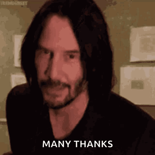 Man with Long Hair and Beard Giving Thumbs Up