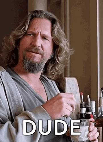 Man with Long Hair and Beard Holding Cup Dude