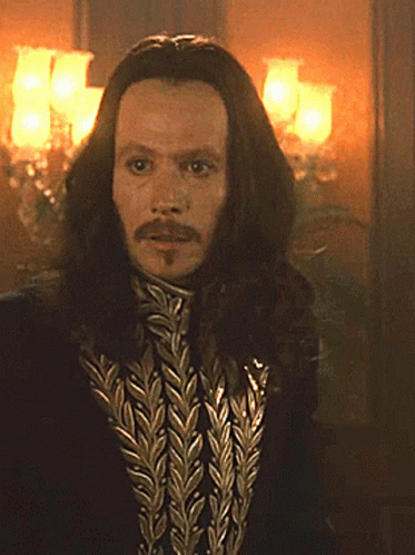 Man with Long Hair and Beard in Black Jacket