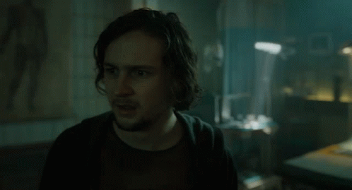 Man With Long Hair And Beard In Dark Room GIF