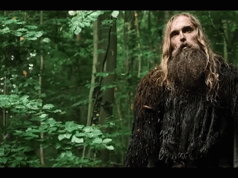 Man With Long Hair And Beard In Forest GIF