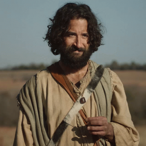 Man With Long Hair and Beard in Sheepskin Strap