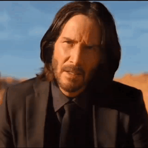 Man with Long Hair and Beard in Suit