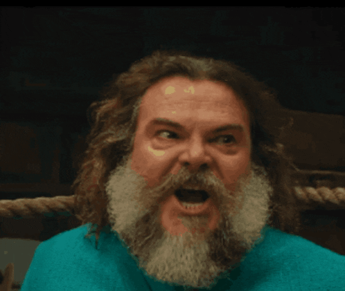 Man With Long Hair And Beard Making Funny Face GIF