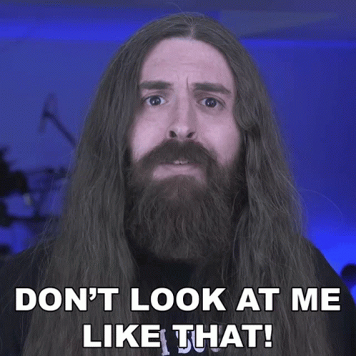 Man with Long Hair and Beard Saying Don't Look at Me