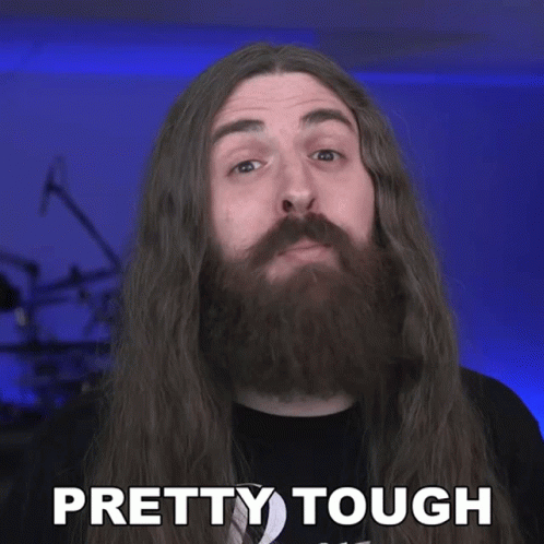 Man With Long Hair and Beard Saying Pretty Tough