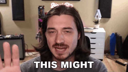 Man With Long Hair and Beard Saying This Might