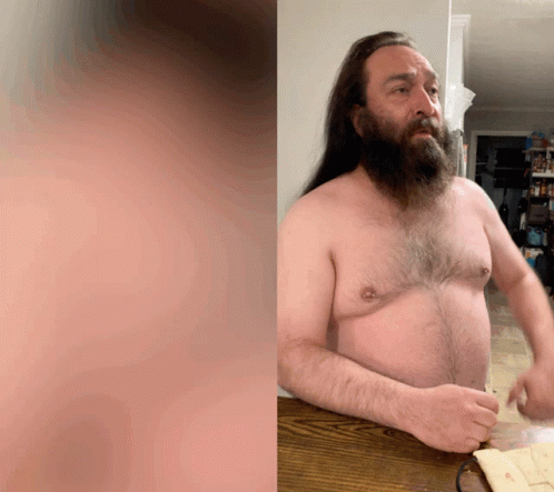 Man with Long Hair and Beard Sitting