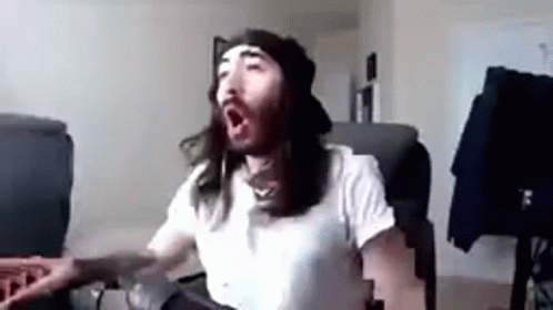 Man with Long Hair and Beard Yawning