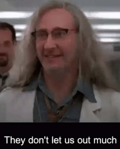 Man With Long Hair And Glasses In Lab Coat And Tie GIF