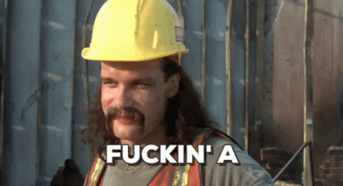 Man With Long Hair and Mustache in Hard Hat Says Fuckin A