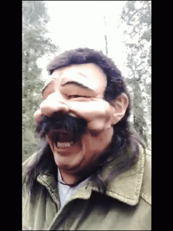 Man With Long Hair and Mustache Wears Mask