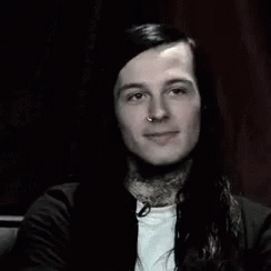 Man With Long Hair And Neck Tattoo Smiling GIF