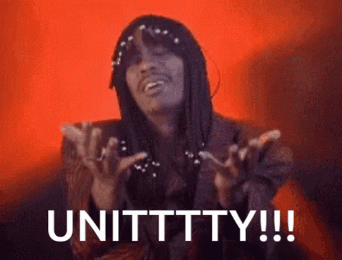 Man With Long Hair And Pearls Says Unittty GIF