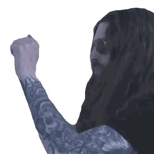 Man with Long Hair and Tattooed Arm Fist Pump