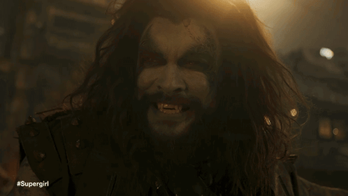 Man with Long Hair, Beard, #Supergirl on Face