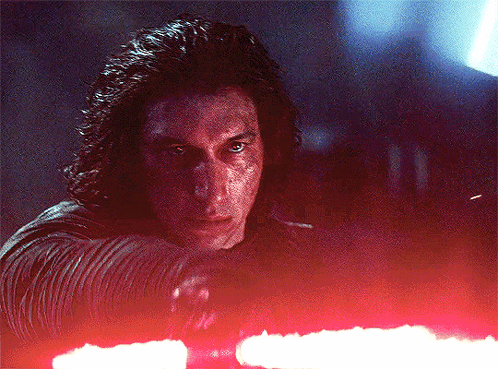 Man With Long Hair Holding Red Lightsaber GIF