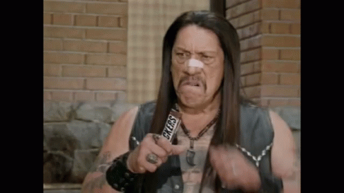 Man With Long Hair Holding Snickers Bar