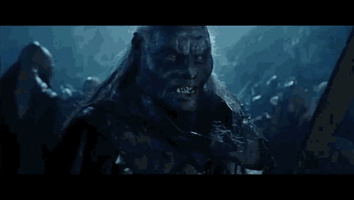 Man With Long Hair Holding Sword GIF