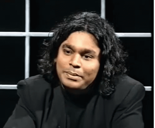 Man with Long Hair in Black Shirt