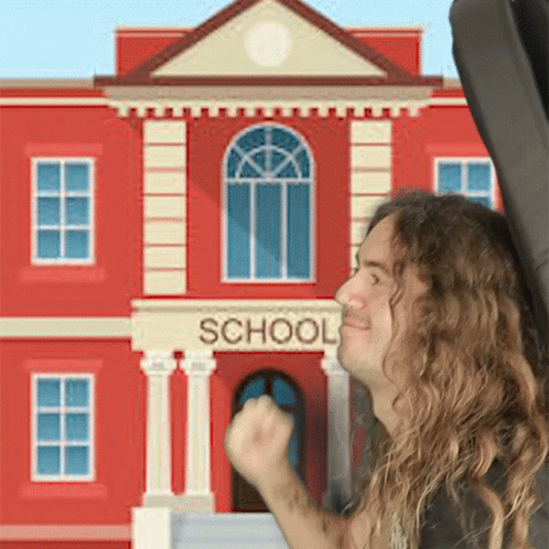 Man with Long Hair in Front of School
