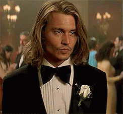 Man With Long Hair in Tuxedo and Bow Tie