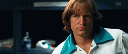 Man With Long Hair In White Shirt And Blue Collar GIF