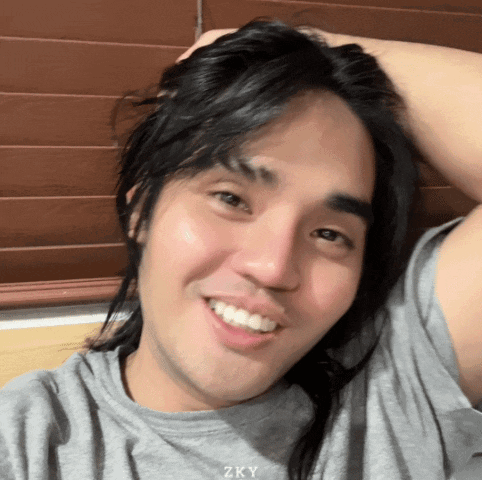 Man With Long Hair Smiling Shirt Says Zky GIF