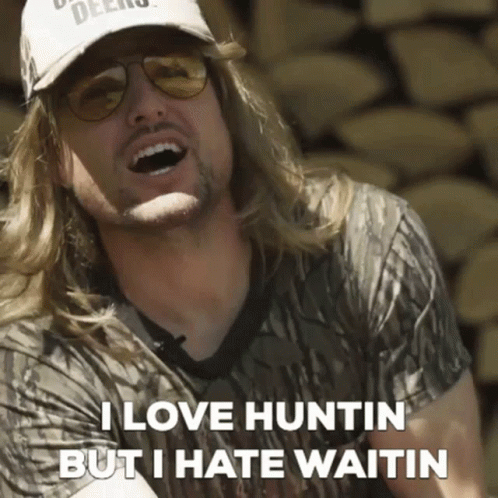Man With Long Hair Sunglasses and Deer Hat