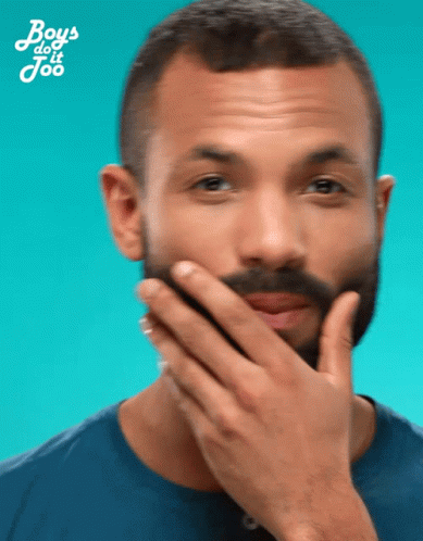 Man with Long Red Beard Holding Beard