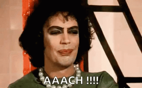 Man With Makeup Pearl Necklace Green Shirt GIF