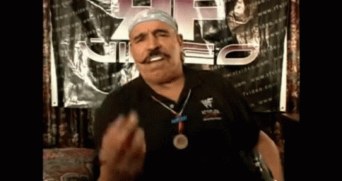 Man With Medal and Wrestlemania Shirt